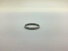 A Narrow Wedding Band, stamped "Platinum" (finger size O) (2.8grams)