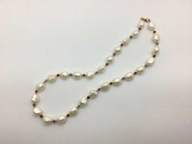 A Modern Fresh Water Pearl Bead Necklace, with faceted and bead spacers, to clasp stamped "375" (