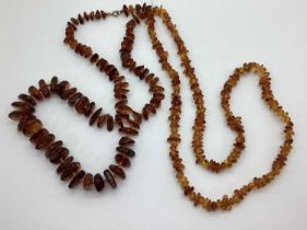 A Modern Tumbled Amber Graduated Bead Necklace, together with another necklace. (2)