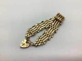 A 9ct Gold Gate Link Bracelet of Panel Design, stamped "ASJ", featuring a heart padlock and safety