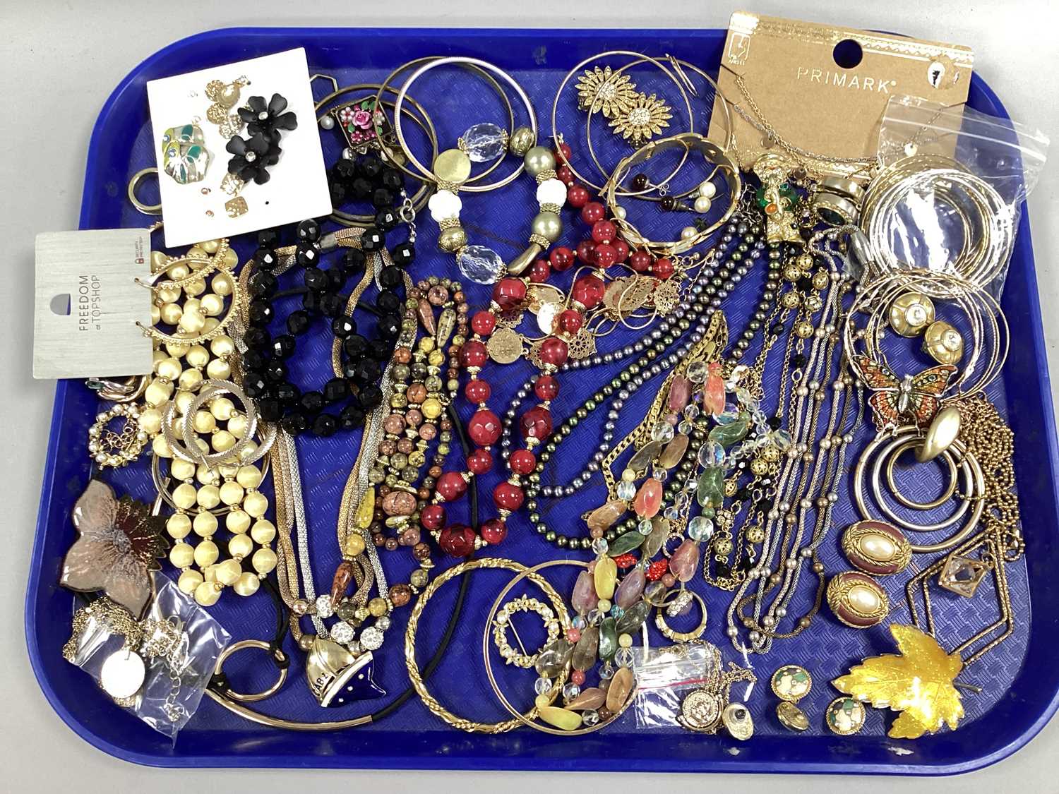 An Assortment of Modern Costume Jewellery, to include gilt coloured multi-strand necklaces,