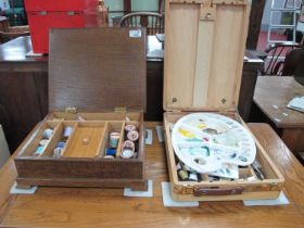 Oak sewing box with cotton reels, together with an artists travelling box (2).