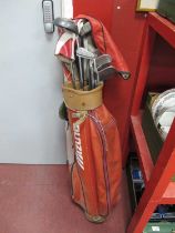 A Set of Golf Clubs, Henry Potter 7-8 clubs, etc in red Mizuno golf bag.