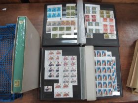 Stamps; a collection of mainly mint Great Britain commemorative stamps, housed in three stock