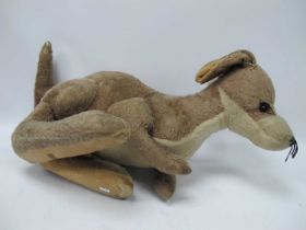 A well loved circa 1960's Merrythought Soft Toy Kangaroo, wear and tear noted. Approx length 70cm.
