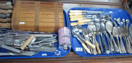 A Selection of assorted cutlery, including knives, forks, spoons, sugar tongs, a wooden knife block,