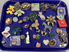 A Collection of Costume Brooches, including Rotary International cat badge, zebra brooch, flowers,