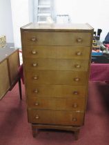 Wrighton Furniture; A 1970's Walnut chest of seven drawers, on tapering supports.