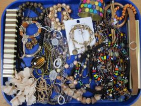 Assorted Costume Jewellery, in hues of brown, including bead necklaces, wide bangle, etc :- One