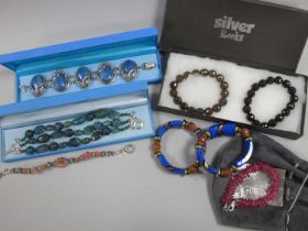 Modern Bracelets, including Art Nouveau style panel bracelet, highlighted in blue, stamped "925";