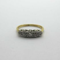 A Vintage Five Stone Diamond Ring, graduated illusion set, stamped "18ct" (finger si\e L) (2grams).