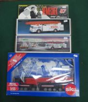 Four Diecast and Plastic Model Vehicles to Include; Siku 1:55 #4311, Siku Mega Lifter, Hess Toy Fire