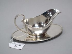 A Hallmarked Silver Sauce Boat on Stand, FC, Sheffield 1933, each of plain oval form with textured