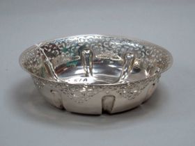 A Decorative Hallmarked Silver Dish, of circular form, scroll pierced, 23.5cm diameter (495grams).