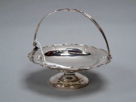 A Hallmarked Silver Swing Handled Footed Dish, Birmingham 1920, of shaped circular form with