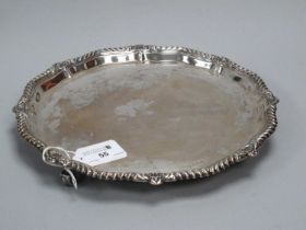 A Hallmarked Silver Salver, HW, Sheffield 1930, of shaped circular form, within gadrooned and