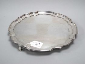 A Hallmarked Silver Salver, H.F.& Co, Sheffield 1946, of plain shaped circular form, raised on three