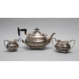 A Hallmarked Silver Three Piece Tea Set, Walker & Hall, Sheffield 1930, each of semi gadrooned