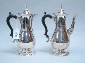 A Hallmarked Silver Coffee Pot and Matching Hot Water Pot, (makers marks rubbed) London 1928, each