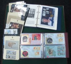 Stamps; A deluxe 'Millennium Collection' album contains over sixty unaddressed Benham covers from