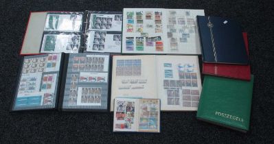 Stamps; a collection of mainly Queen Elizabeth II Great Britain stamps, housed in seven stock