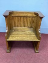 A XX Century Oak Bench, with linenfold back panel and solid seat on chamfered supports and plinth