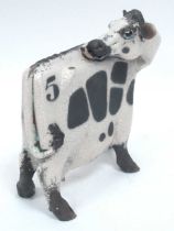 Lawson J. Rudge (b.1936) *ARR; A Raku Pottery Licking Flat Cow, spot pattern, numbered 5,