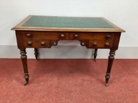 A XIX Century Mahogany Writing Table, with crossbanded top inset with green leatherette sciver above