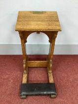 A XX Century Oak Littany Desk, with sloping top, shaped sides and kneeler, side rails.