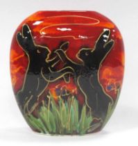 An Anita Harris Pottery Purse Vase, decorated with the 'Boxing Hares' pattern, gold signed to