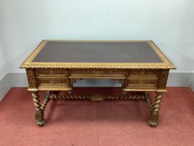 An Early XX Century Continental Carved Oak Desk, the top inset with maroon leather sciver with