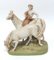 A Royal Dux Pottery Model of a Young Man Riding a Horse, another by his side, upon a naturalistic