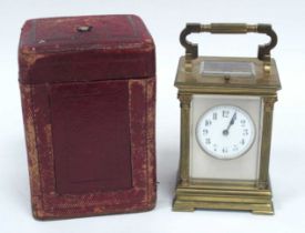 A French Late XIX Century Brass Repeater Carriage Clock, with column sides, the white enamel dial