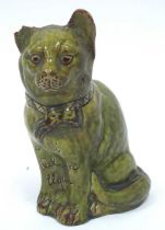 A Jones, Bridgend Pottery Green Glazed Model of a Cat, inscribed to the chest "A Gaf fi Sal eich