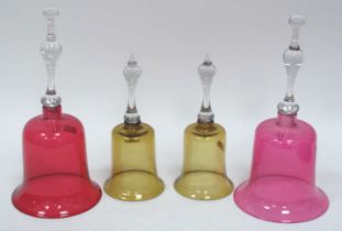 A Pair of Victorian Cranberry Glass Bells, with clear handles, 29cm high and a pair of amber glass