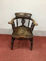 A XIX Century Ash and Elm Pad Arm Captain's Chair, with a shaped pierced splat and turned spindles