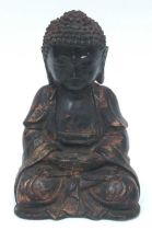 A Chinese Bronze Seated Buddha, with traces of gilt, 22cm high.