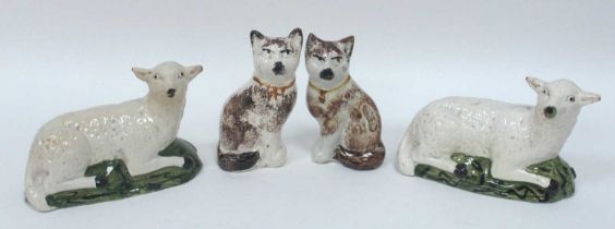 A Pair of Staffordshire Pottery Models of Cats Seated, painted with brown markings and collars, 12.