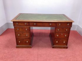 A XIX Century Mahogany Pedestal Desk, with crossbanded top inset with green leather sciver over