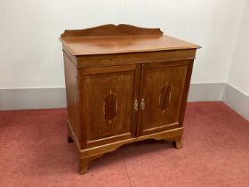 An Edwardian Inlaid Mahogany Press, with shaped back, two inlaid panelled doors to two internal