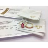 The Genuine Gemstone Company Ltd; A 9ct Gold Madagascan Ruby Ring, the pear shape stone to three