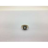 A 9ct Gold Stone Set Dress Ring, the emerald cut centre stone to alternatley cut outer stones, (