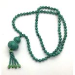 Polished Bead Necklace, suspending shaped drop with beaded tassel.