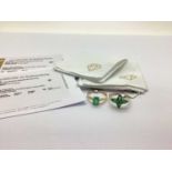 The Genuine Gemstone Company Ltd; A 9ct Gold Zambian Emerald Ring, the pear shape stones to four