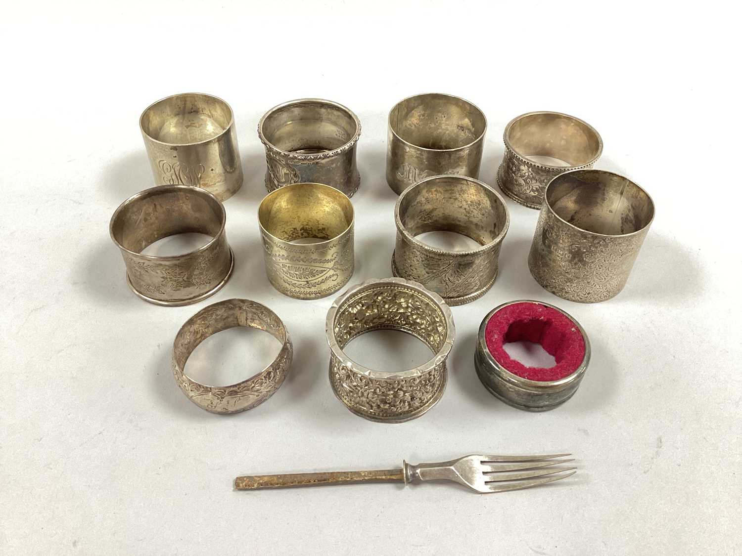 A Collection of Hallmarked Silver and Other Napkin Rings, (some initialled) a wine bottle drip ring,