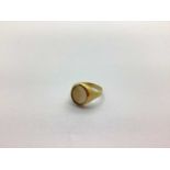 A 9ct Gold Signet Ring, with hardstone inlay set between tapered shoulders of plain design, (