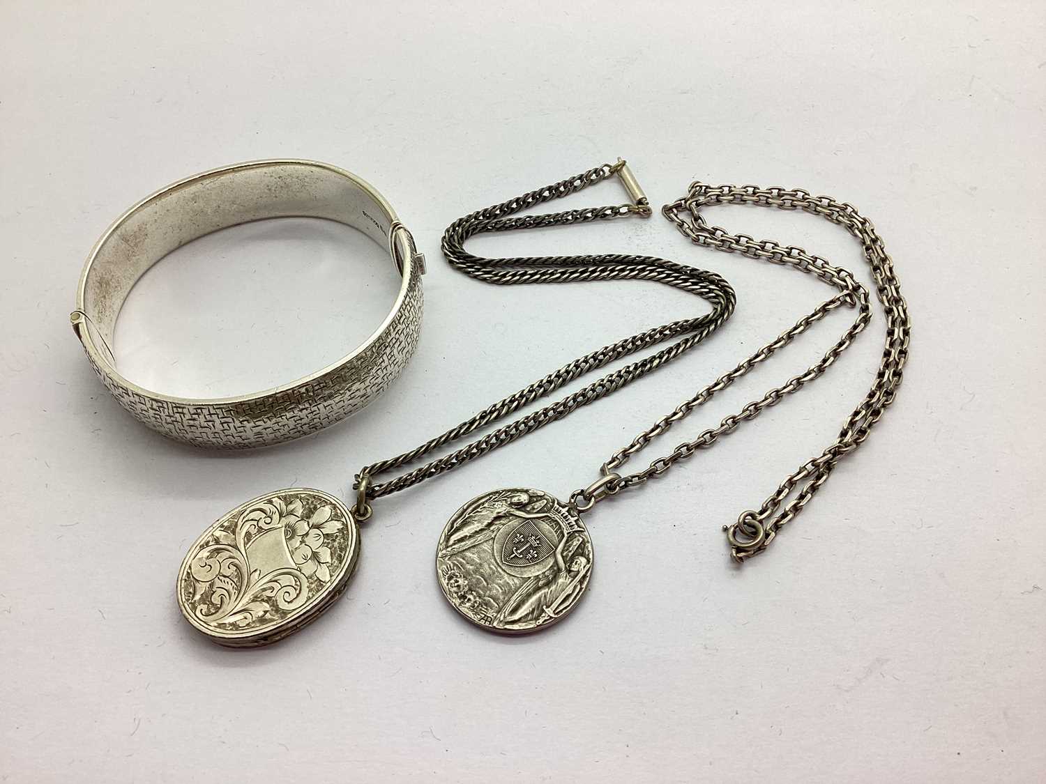 Joan of Arc 1915 Medallion Pendant, stamped "ABargas", on a chain; togerther with a foliate engraved