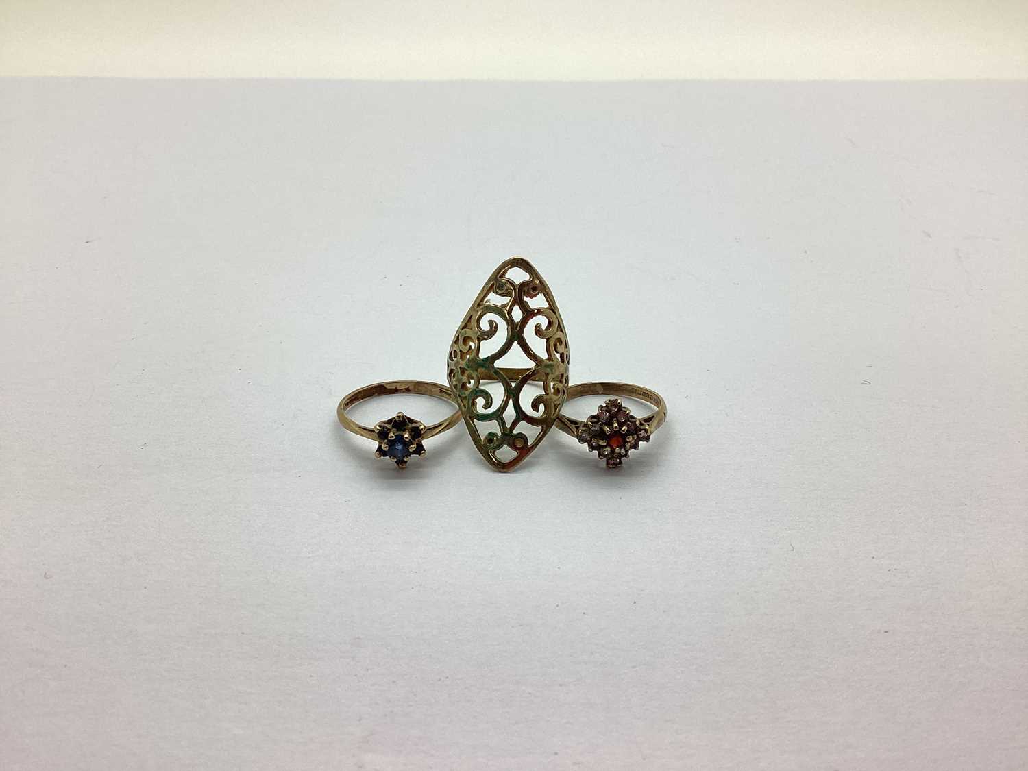 A 9ct Gold Dress Ring, of scrolling openwork design, together with two further 9ct gold stone set