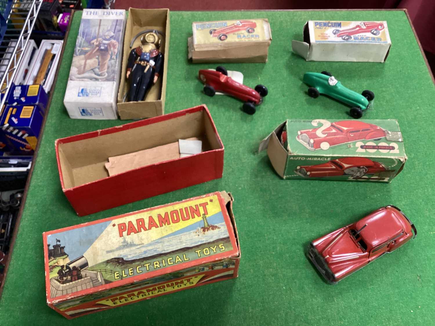 Two Penguin Plastic Racers, a French Auto-Miracle Tinlate Car, a Saxon Toy Diver, all playworn/