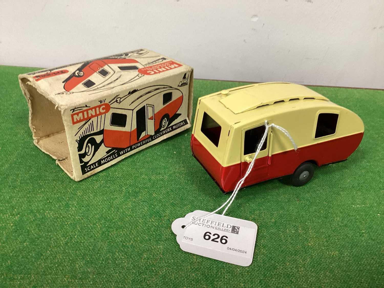A Post War Minic Tinplate Caravan, cream/maroon, excellent, boxed, box missing flaps to one end.